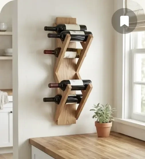 An angled wall-mounted wooden wine rack holding bottles.